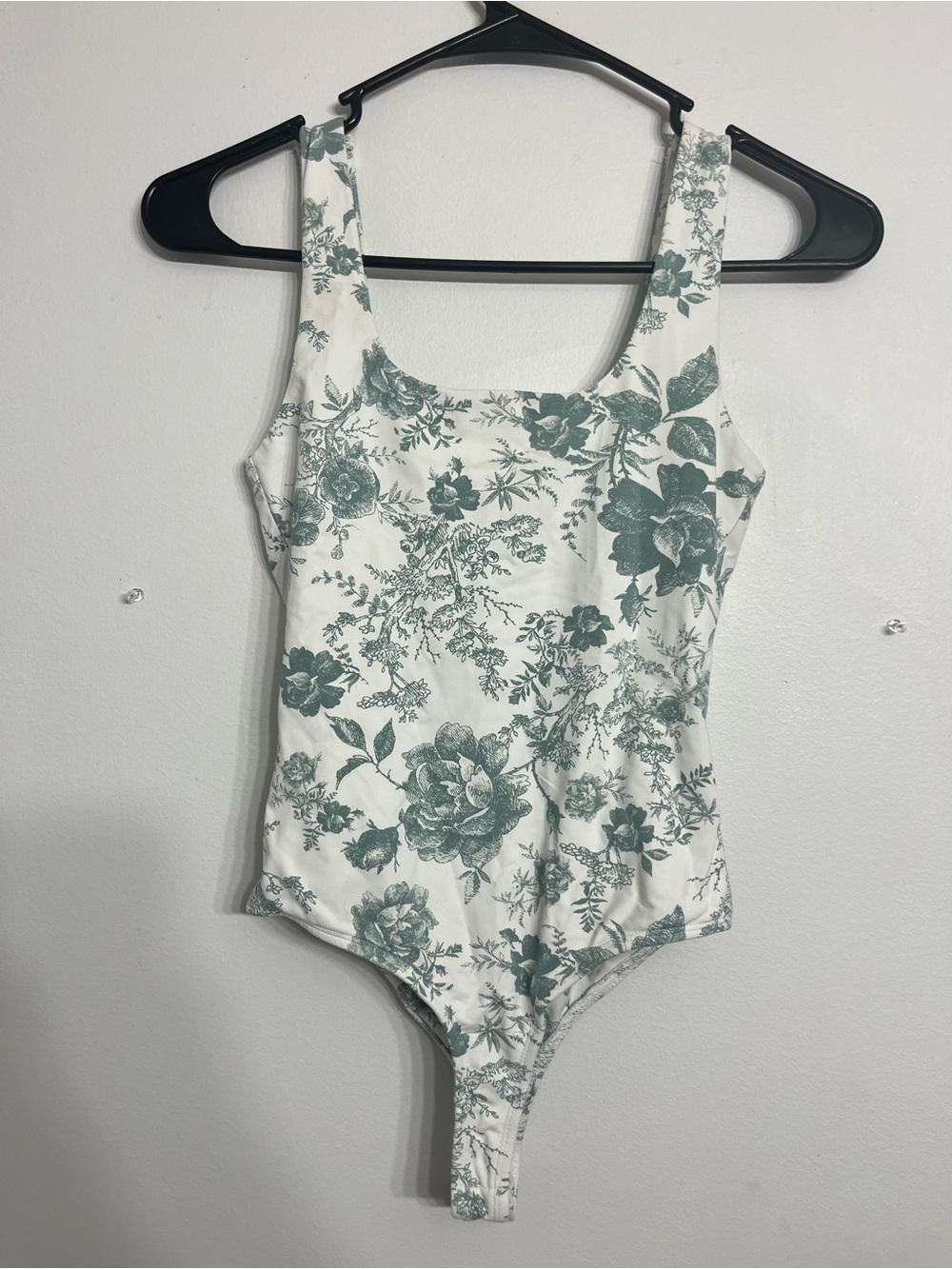 Francesca’s sage green and white floral bodysuit size XS/S